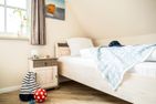  Ferienhaus Schilfrohrsänger 30 Fuhlendorf - Schlafzimmer