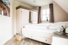  Ferienhaus Schilfrohrsänger 30 Fuhlendorf - Schlafzimmer