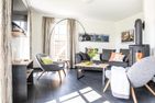  Ferienhaus Schilfrohrsänger 26 Fuhlendorf - Wohnzimmer