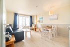  Nordland Appartements Wohnung Fünen Wyk auf Föhr - Vom Wohnzimmer aus haben Sie direkten Zugang auf die Terrasse.