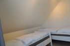  Ferienwohnung Hafen Carolinensiel - Schlafzimmer