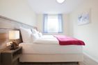 Haus Inselzauber Dünenveilchen Fischerhafen - Schlafzimmer