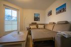 Residenz Rosengrund Meeresbrise mit Schwimmbad Büsum - Wohnzimmer