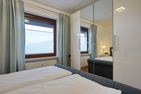 Schloss am Meer Wohnung 41 mit seitlichem Hafenblick Büsum - Schlafzimmer