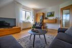  Ferienwohnung am Sieltief Krummhörn - Wohnzimmer