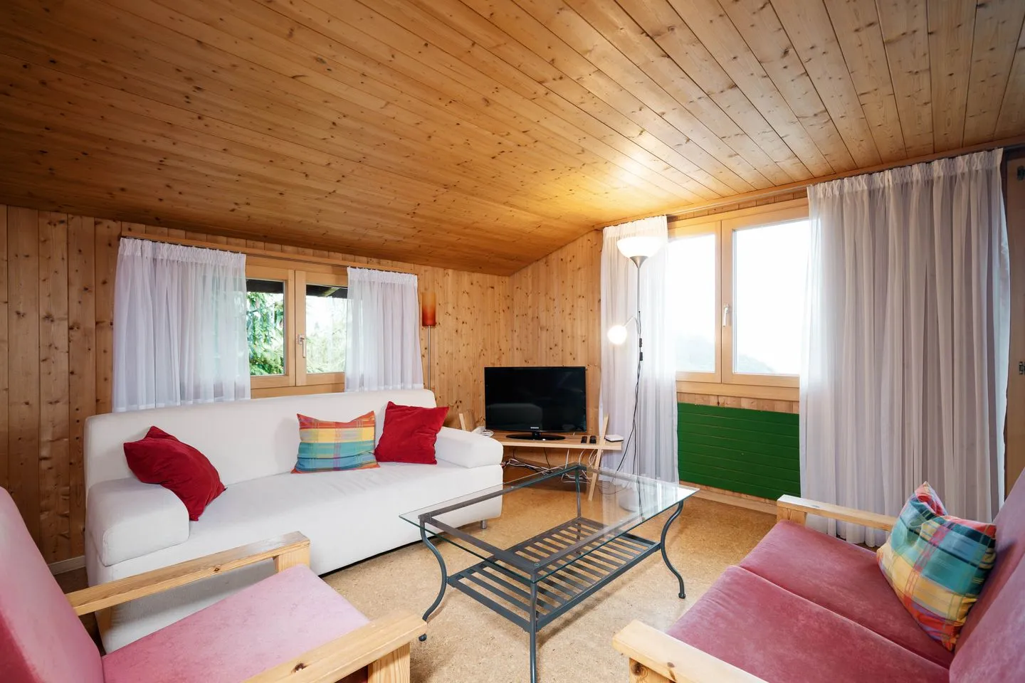 Apartment Sidonie Amden - Wohnzimmer mit Sofa und Sessel