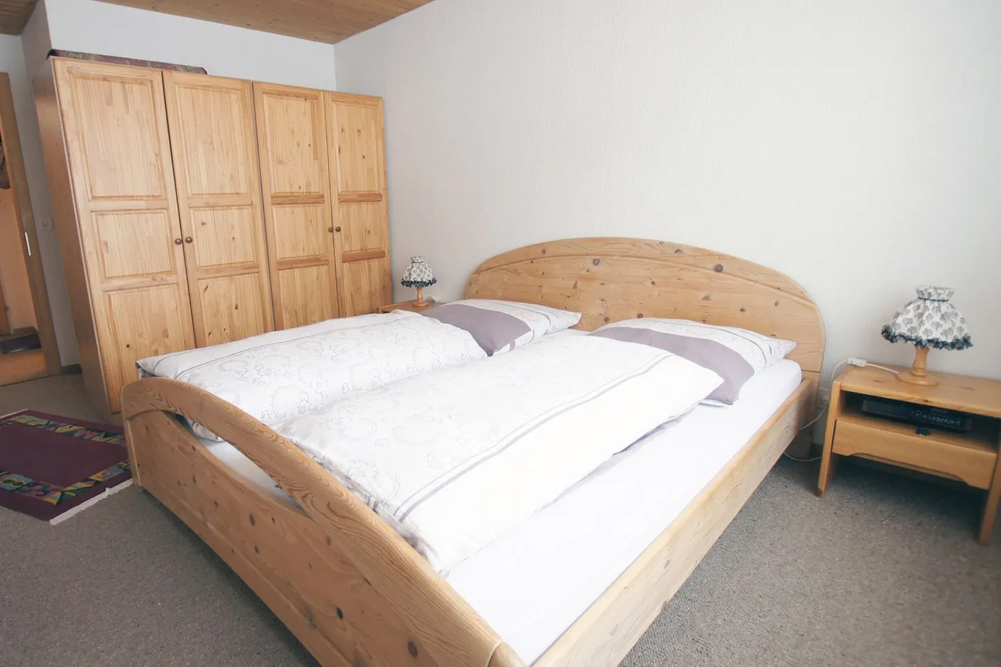 Apartment Kaiser Arvenbüel - Schlafzimmer mit Doppelbett