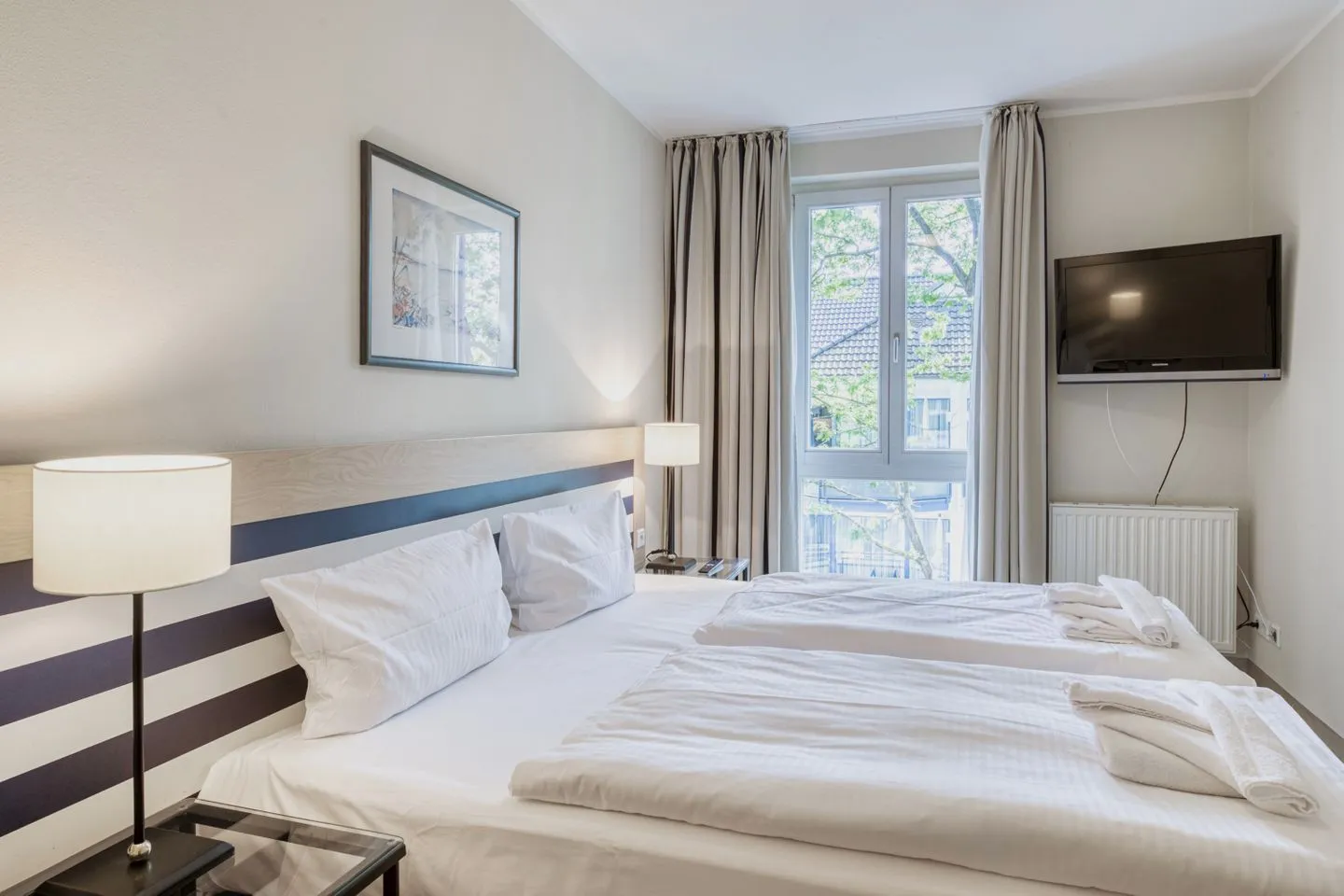 Ostseeanker Zingst - Ferienwohnung Ostseeanker in Zingst Blick ins Schlafzimmer mit gemütlichem Doppelbett