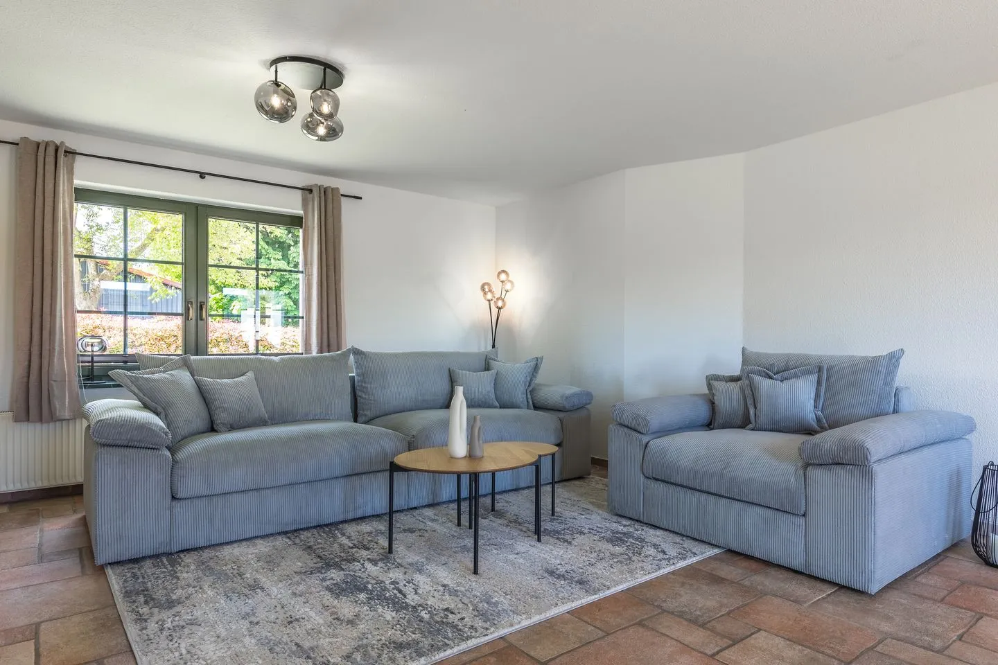 WiesenQuartier Penkow - Ferienhaus Wiesenquartier Penkow Wohnzimmer mit großer Couch