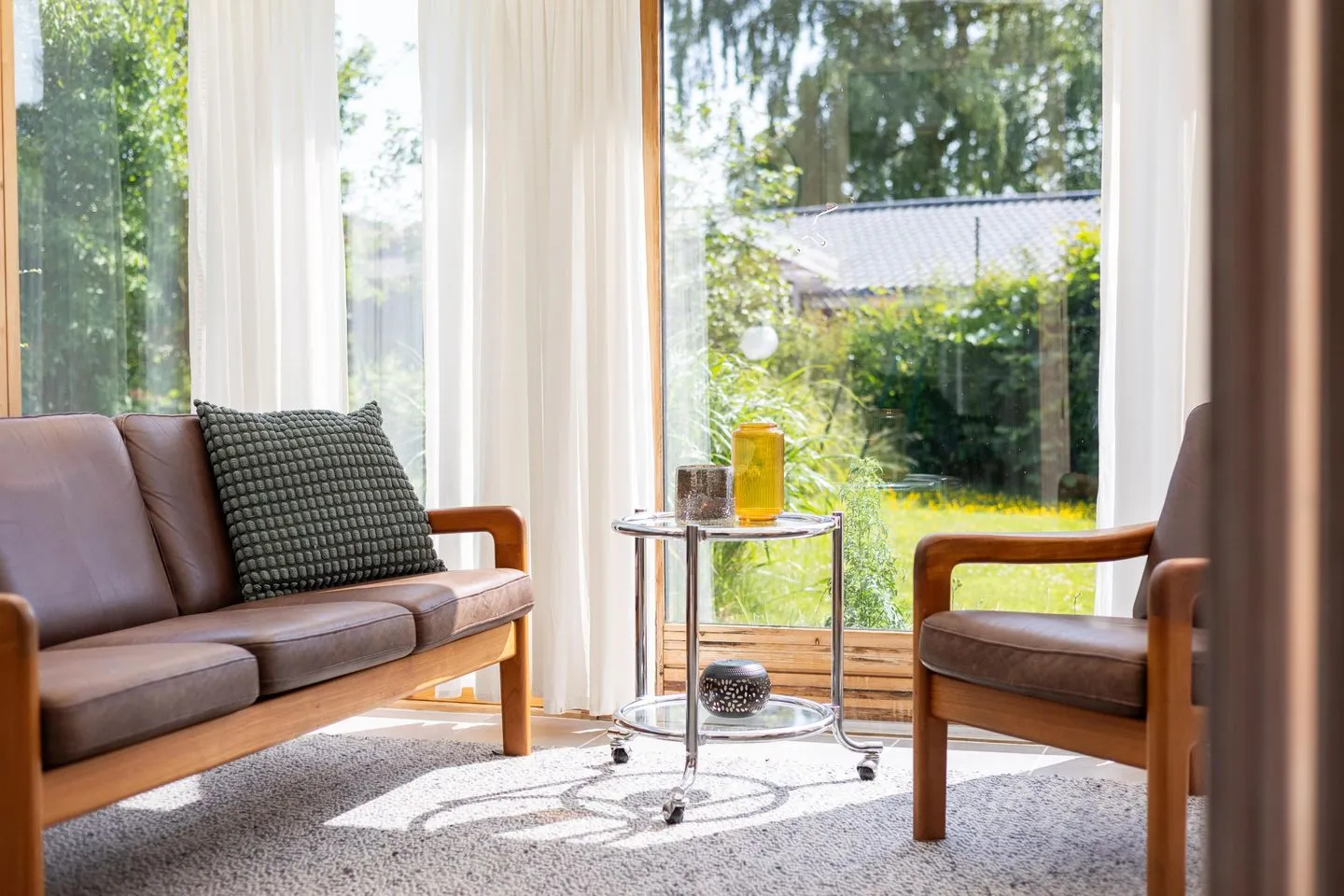 VITA Sonnholm Flensburger Förde - Wintergarten mit Ausblick in den verträumten Garten