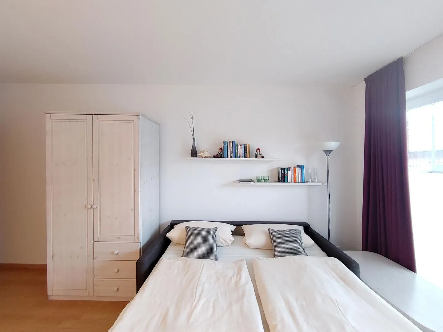 Haus *Südspitze 17* Ferienwohnung *Auszeit am Meer* Wittdün auf Amrum - Wohnzimmer mit Schlafcouch in der Ferienwohnung Auszeit am Meer in Wittdün auf Amrum