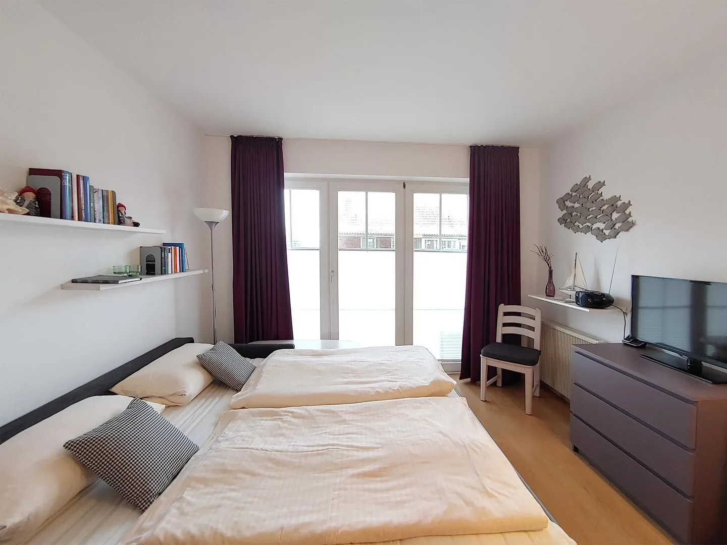 Haus *Südspitze 17* Ferienwohnung *Auszeit am Meer* Wittdün auf Amrum - Wohnzimmer mit Schlafcouch in der Ferienwohnung Auszeit am Meer in Wittdün auf Amrum